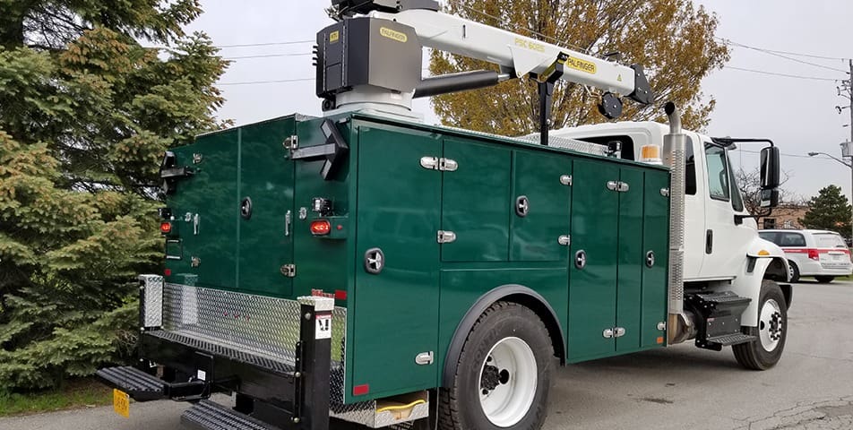Green Mechanics Truck Body with crane attachment and side tool storage compartments