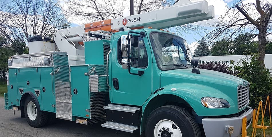 Teal Utility Truck Body with bucket crane and side storage compartments - cone holders on front